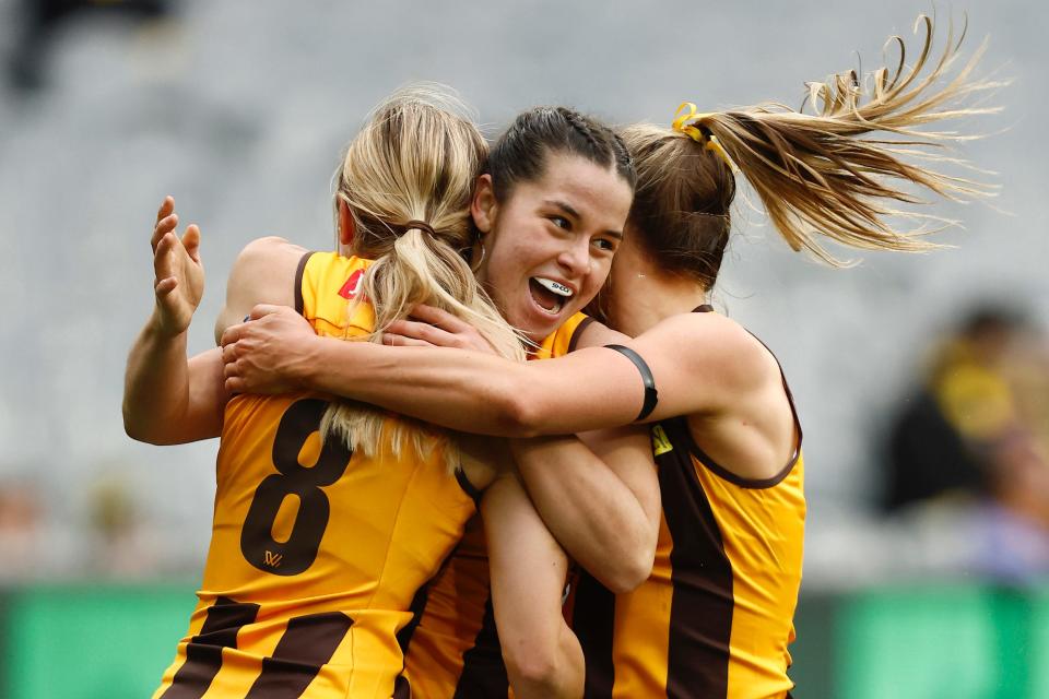 Dominique Carbone of the Hawthorn Hawks celebrates a goal during her team's AFLW Practice Match against the Richmond Tigers at Melbourne Cricket Ground in Melbourne, Australia.