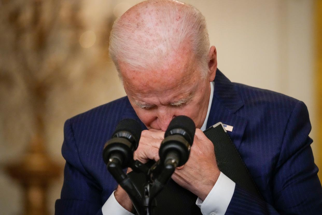 U.S. President Joe Biden pauses while listening to a question from a reporter about the situation in Afghanistan in the East Room of the White House on Aug. 26, 2021, in Washington, DC. At least 12 American service members were killed on Thursday by suicide bomb attacks near the Hamid Karzai International Airport in Kabul, Afghanistan.