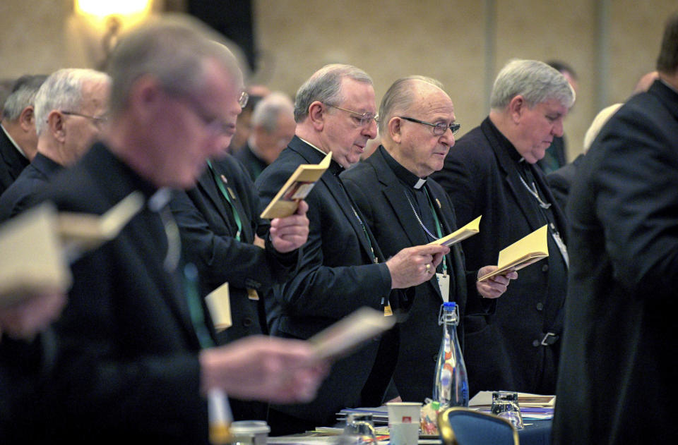 Bishops sing during an opening hymn at the start of the United States Conference of Catholic Bishops Fall General Assembly at the Baltimore Marriott Waterfront Monday, Nov. 11, 2019. (Jerry Jackson/The Baltimore Sun via AP)