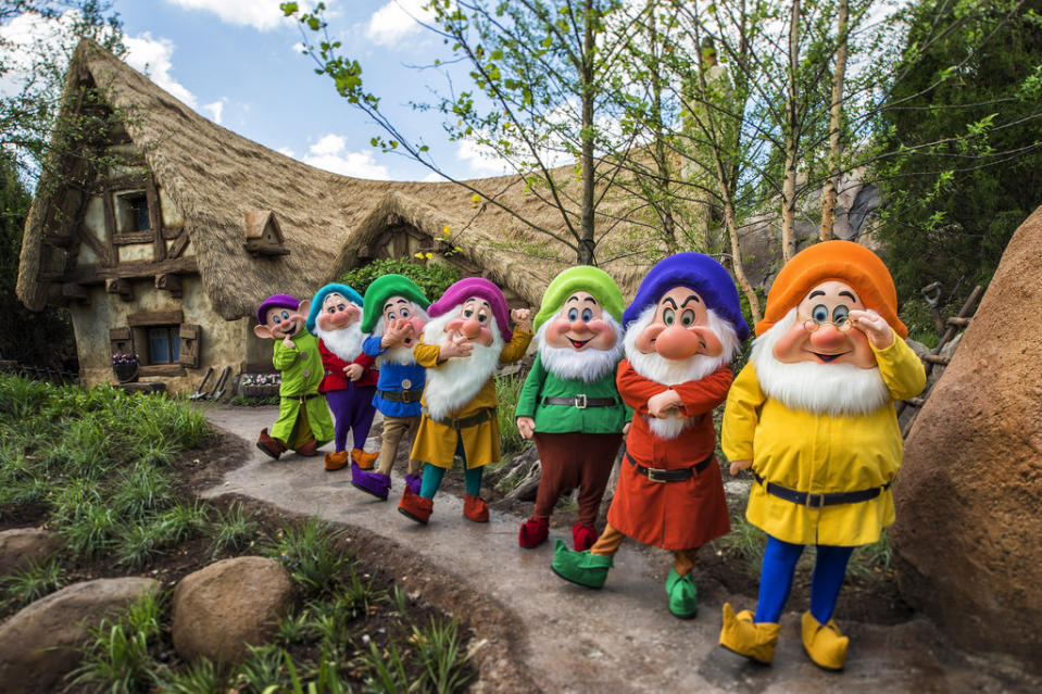 Snow White's seven dwarfs in front of the Seven Dwarfs Mine Ride