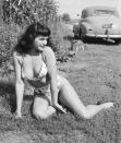 <p>The pin-up star was known for her signature baby bangs and her racy photos. </p>