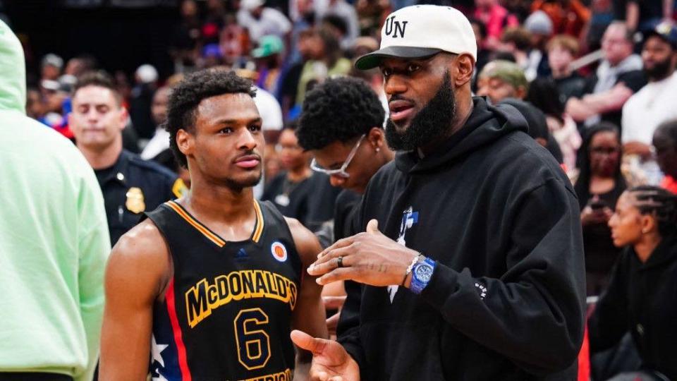 Bronny James talks to his father LeBron James