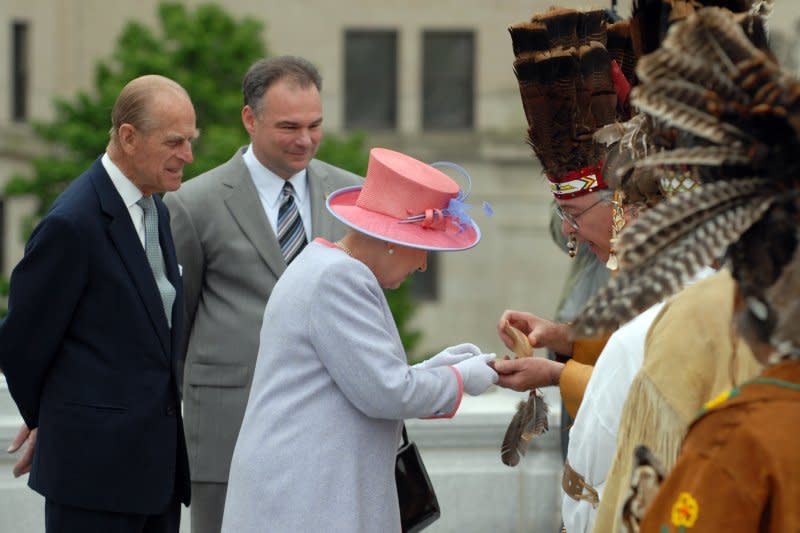Britain's Queen Elizabeth II receives a gift from Native Americans while Gov. Tim Kaine and her husband, Prince Philip, look on at the Virginia State Capitol in Richmond on May 3, 2007. File Photo by Roger L. Wollenberg/UPI