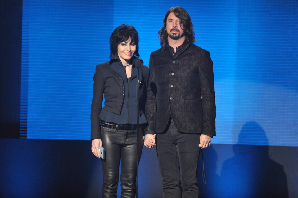 Joan Jett, left, and Dave Grohl present the award for favorite artist - alternative rock at the American Music Awards at the Nokia Theatre L.A. Live on Sunday, Nov. 24, 2013, in Los Angeles. (Photo by John Shearer/Invision/AP)