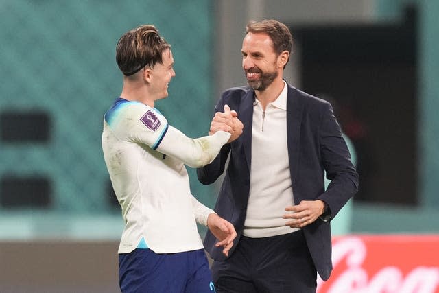 Jack Grealish, left, celebrates with manager Gareth Southgate