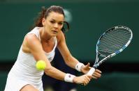 <p>Agnieszka Radawanska of Poland plays a backhand during the Ladies Singles second round match against Kateryna Kozlova of Ukraine on day three of the Wimbledon Lawn Tennis Championships at the All England Lawn Tennis and Croquet Club on June 29, 2016 in London, England. (Photo by Julian Finney/Getty Images)</p>