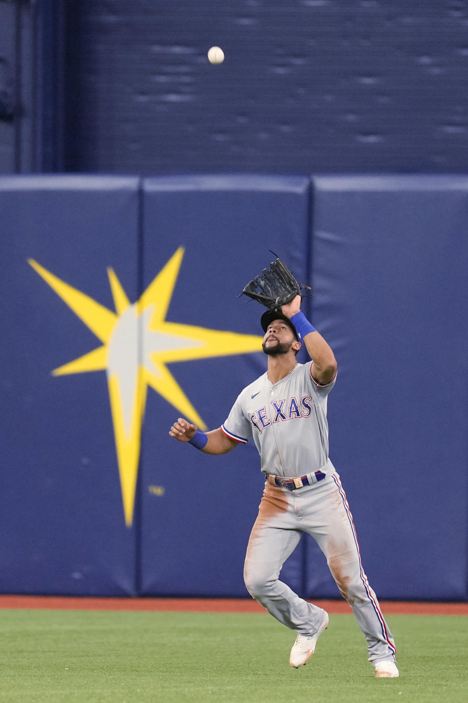 Texas Rangers center fielder Leody Taveras catches a fly ball hit by Manuel Margot in the seventh inning during Game 2 in an AL wild-card baseball playoff series, Wednesday, Oct. 4, 2023, in St. Petersburg, Fla. (AP Photo/John Raoux)