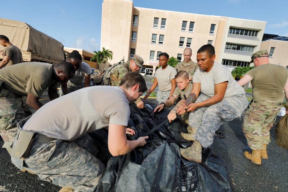 On the U.S. Virgin Islands on Sunday, soldiers from the 602nd Area Support Medical Company break down a field hospital outside the Schneider Regional Medical Center while preparing to evacuate in advance of Maria. (Photo: Jonathan Drake / Reuters)