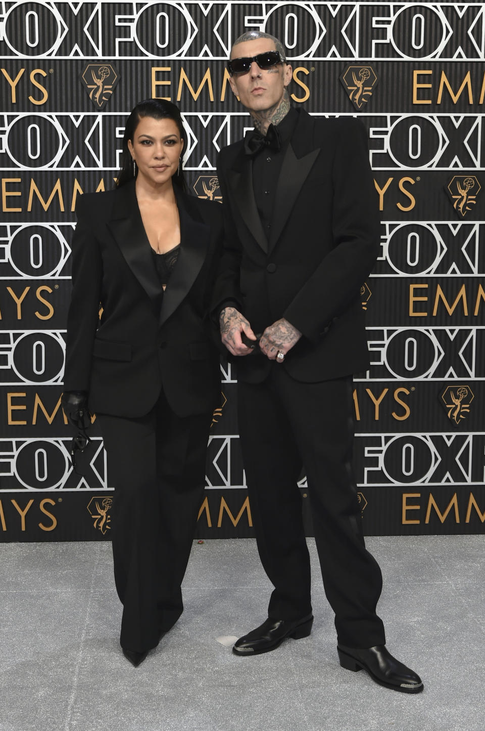 Kourtney Kardashian, left, and Travis Barker arrive at the 75th Primetime Emmy Awards on Monday, Jan. 15, 2024, at the Peacock Theatre in Los Angeles. (Photo by Richard Shotwell/Invision/AP)