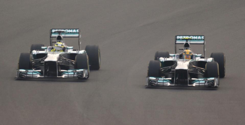 Mercedes Formula One driver Rosberg and teammate Hamilton drive during the Indian F1 Grand Prix at the Buddh International Circuit in Greater Noida