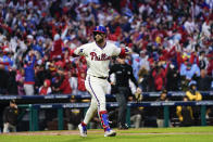 Philadelphia Phillies' Bryce Harper rounds the bases after a two-run home run during the eighth inning in Game 5 of the baseball NL Championship Series between the San Diego Padres and the Philadelphia Phillies on Sunday, Oct. 23, 2022, in Philadelphia. (AP Photo/Matt Slocum)