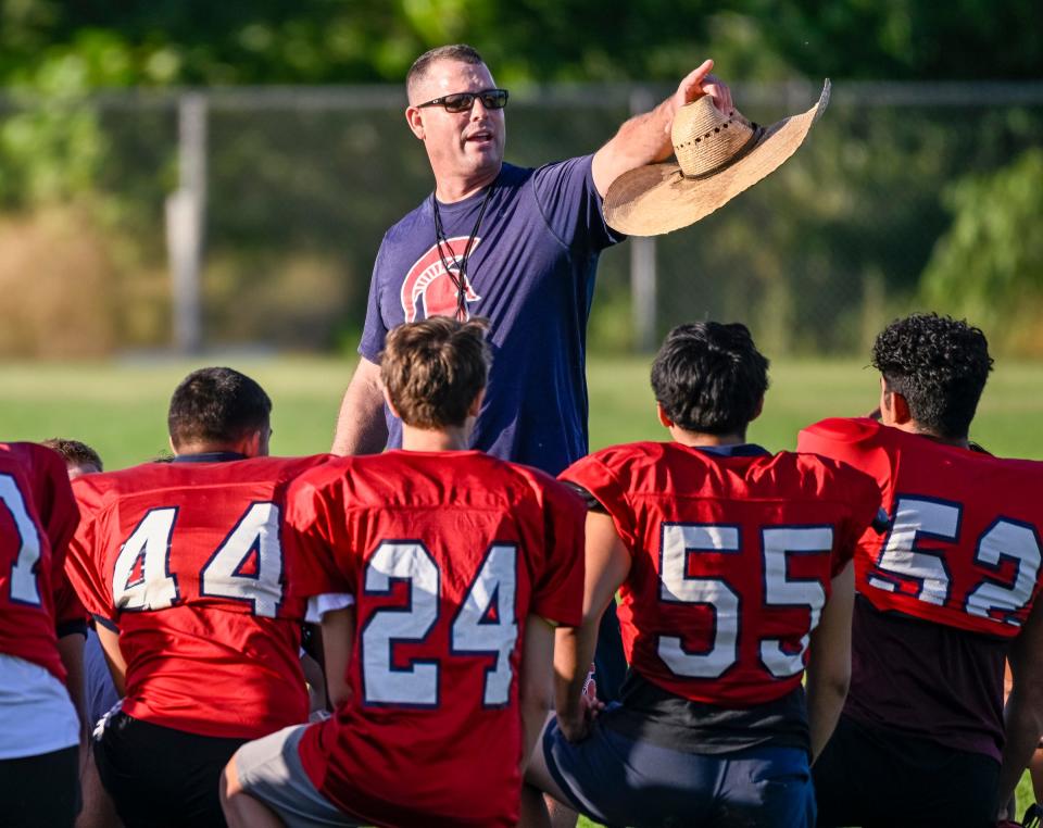 Head Football Coach Jeromy Blackwell works with his team on Wednesday, July 26, 2023 at Strathmore High School. Blackwell has returned to the job he loves and is still recovering after a life-threatening health scare that put him in the hospital for two weeks in June.