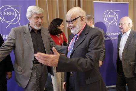File photo of Belgium physicist Francois Englert (C) arriving next to CERN Director general Rolf Heuer and British physicist Peter Higgs (R) for a group picture after a news conference update in the search for the Higgs boson at the European Organization for Nuclear Research (CERN) in Meyrin near Geneva July 4, 2012. REUTERS/Denis Balibouse/Files