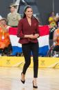 <p>To watch the US v Netherlands basketball final the pregnant Duchess wore a maroon wrap top with peplum by popular luxury Australian label <a href="https://us.scanlantheodore.com/collections/w18-rwt/products/crepeknitwrapjacketgarnet" rel="nofollow noopener" target="_blank" data-ylk="slk:Scanlan Theodore;elm:context_link;itc:0;sec:content-canvas" class="link ">Scanlan Theodore</a>, with black <a href="https://outlanddenim.co.uk/collections/women-1/products/harriet-in-black-1" rel="nofollow noopener" target="_blank" data-ylk="slk:Outland jeans;elm:context_link;itc:0;sec:content-canvas" class="link ">Outland jeans</a> and <a href="https://www.sarahflint.com/collections/pumps-1/products/jay-pump-100-black-suede?variant=28249886273&clickId=2480597981&clickId=2480597981&publisherId=21181" rel="nofollow noopener" target="_blank" data-ylk="slk:Sarah Flint heels;elm:context_link;itc:0;sec:content-canvas" class="link ">Sarah Flint heels</a>.</p>