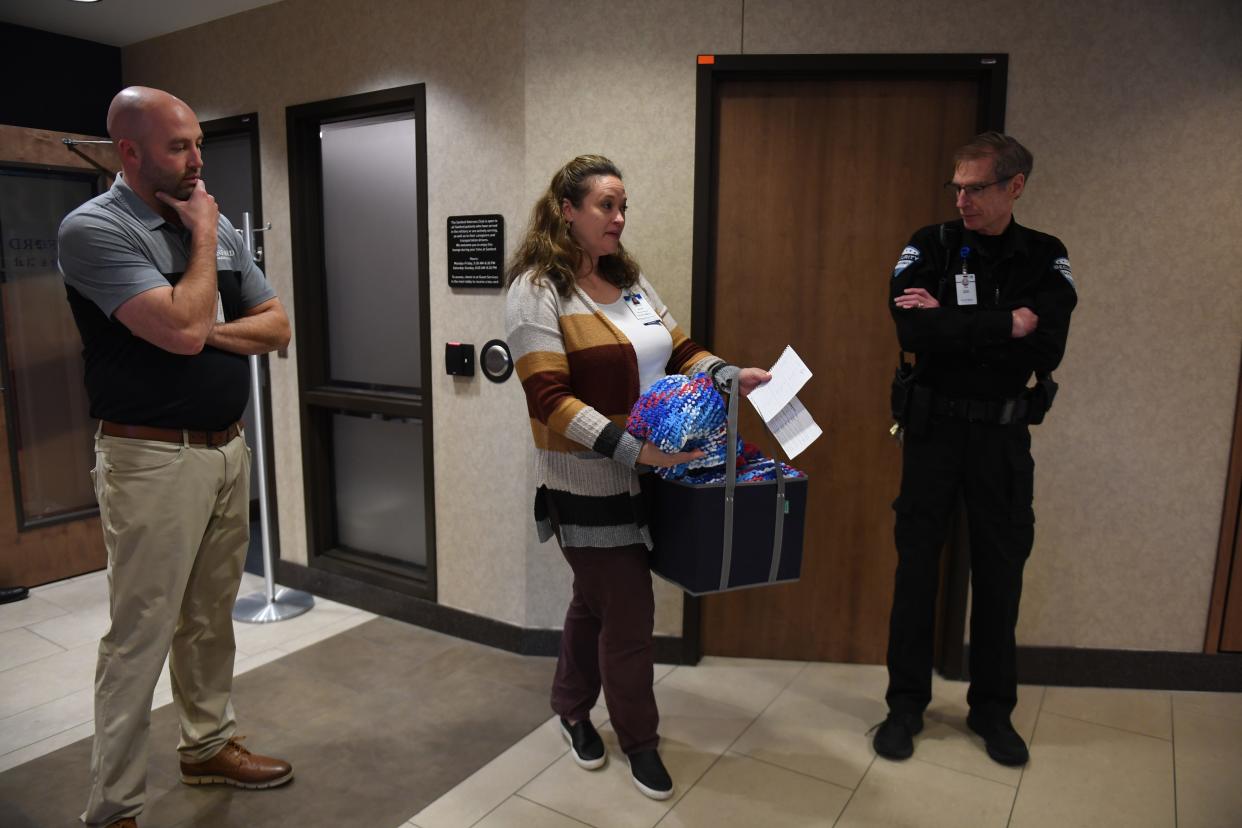 Becca Conner, manager of volunteer services at Sanford Health, prepares to deliver dozens of knitted blankets to veterans on Friday, Nov. 10, 2023 at Sanford USD Medical Center in Sioux Falls, South Dakota.