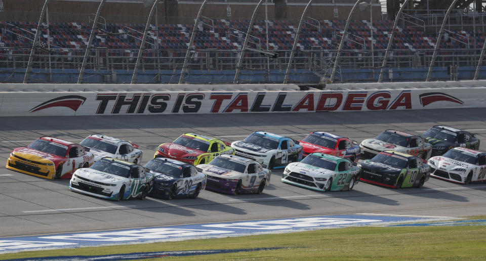 Justin Haley (11) leads the pack at the start of a NASCAR Xfinity auto race at Talladega Superspeedway in Talladega Ala., Saturday, June 20, 2020. (AP Photo/John Bazemore)