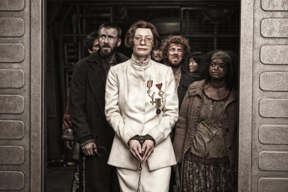 Snowpiercer (2014)Chris Evans (L), Tilda Swinton (center), Octavia Spencer (R)