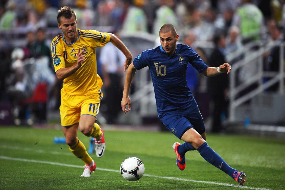 DONETSK, UKRAINE - JUNE 15: Karim Benzema of France and Andriy Yarmolenko of Ukraine compete for the ball during the UEFA EURO 2012 group D match between Ukraine and France at Donbass Arena on June 15, 2012 in Donetsk, Ukraine. (Photo by Lars Baron/Getty Images)