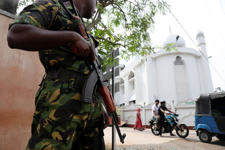 A soldier stands guard outside the Grand Mosque, days after a string of suicide bomb attacks on churches and luxury hotels across the island on Easter Sunday, in Negombo, Sri Lanka April 26, 2019,