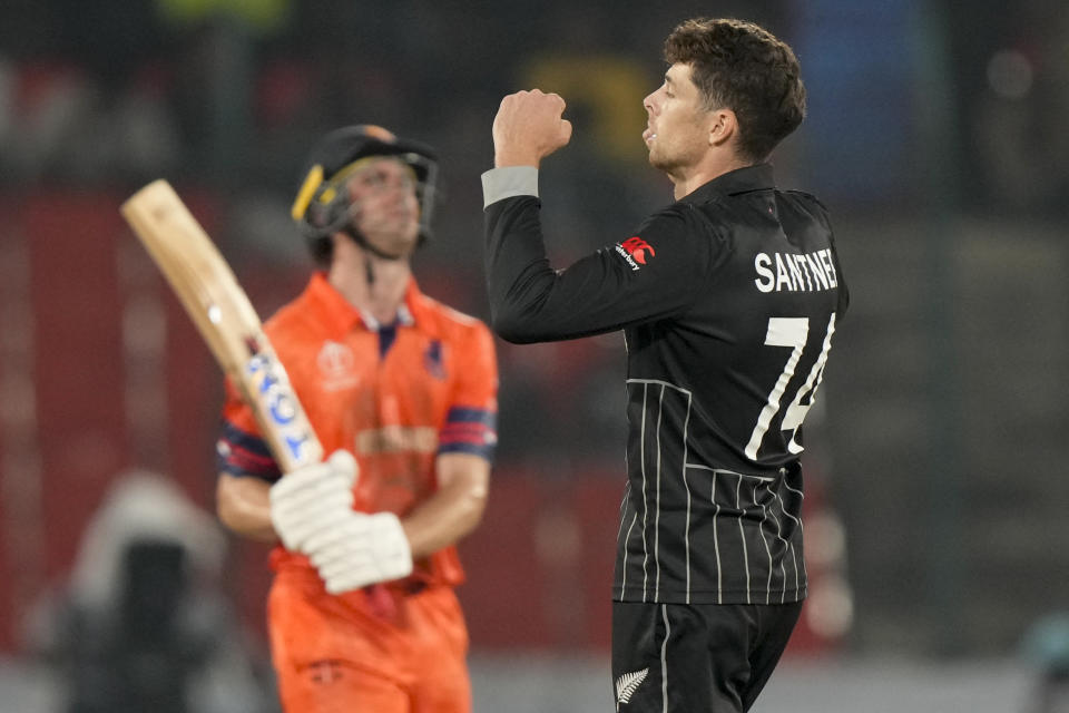 New Zealand's Mitch Santner, right, celebrates the wicket of Netherlands' Colin Ackermann during the ICC Men's Cricket World Cup match between New Zealand and Netherlands in Hyderabad, India, Monday, Oct. 9, 2023. (AP Photo/Mahesh Kumar A.)