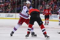 Apr 1, 2019; Newark, NJ, USA; New York Rangers left wing Brendan Lemieux (48) and New Jersey Devils left wing Miles Wood (44) fight during the second period at Prudential Center. Mandatory Credit: Ed Mulholland-USA TODAY Sports