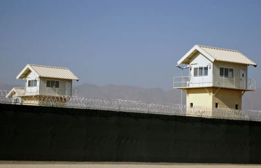 Watchtowers along the perimeter of the Bagram prison, north of Kabul in 2009. The United States on Friday signed a deal transferring the controversial Bagram prison to Afghan control, marking a breakthrough in negotiations over a strategic treaty between the two nations