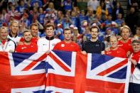 Tennis - Great Britain v Japan - Davis Cup World Group First Round - Barclaycard Arena, Birmingham - 6/3/16 Great Britain's Andy Murray celebrates with captain Leon Smith and team mates after winning his match against Japan's Kei Nishikori Action Images via Reuters / Andrew Boyers