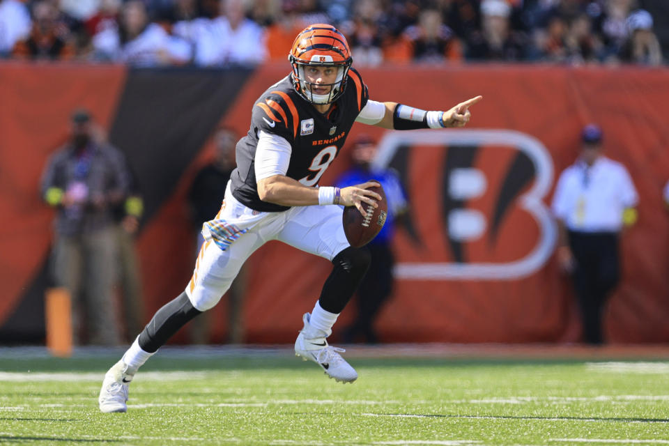 Cincinnati Bengals quarterback Joe Burrow (9) scramble against the Atlanta Falcons in the second half of an NFL football game in Cincinnati, Fla., Sunday, Oct. 23, 2022. (AP Photo/Aaron Doster)