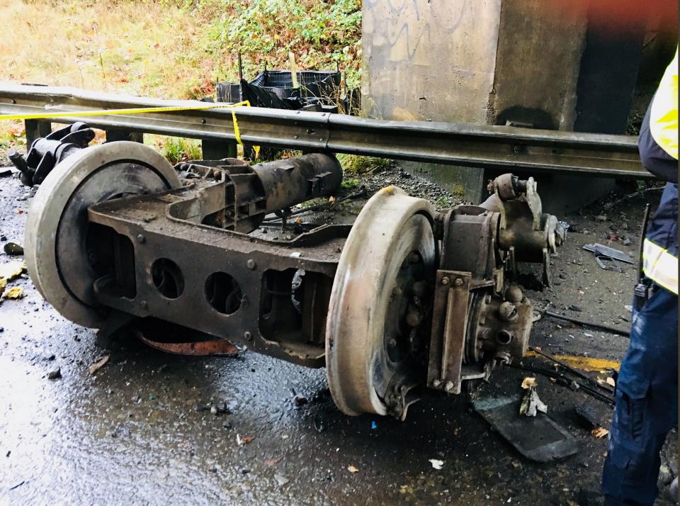 A handout photo made available by the Pierce County Sheriffs Department showing the trucks of Amtrak train 501 which derailed onto Interstate 5 near Tacoma, Washington, USA, 18 December 2017. Reports state that the Amtrak train car fell from an overpass, landing on the highway outside Seattle — Shutterstock/AP