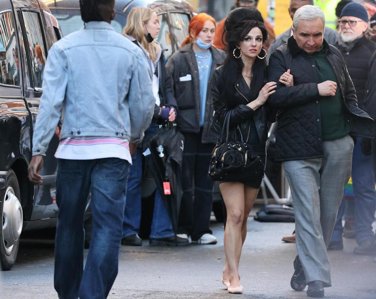 Actress Marisa Abela and actor Eddie Marsan film a scene for the Amy Winehouse biopic 'Back to Black' in London. <a href="https://www.gettyimages.com/detail/news-photo/marisa-abela-and-eddie-marsan-filming-the-new-amy-winehouse-news-photo/1456833483?adppopup=true" rel="nofollow noopener" target="_blank" data-ylk="slk:Neil Mockford/GC Images via Getty Images;elm:context_link;itc:0;sec:content-canvas" class="link ">Neil Mockford/GC Images via Getty Images</a>
