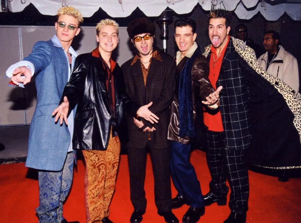 <p>9. The members of 'N Sync did get rich—but not right away, and not until they took matters into their own hands. As it turned out, Pearlman, who died in prison in 2016 while serving a 25-year sentence for money laundering and other crimes committed in the running of a Ponzi scheme, was seemingly screwing them <em>and</em> the Backstreet Boys (and <strong>O-Town</strong> for that matter) out of money.</p> <p><a href="https://abcnews.go.com/US/members-nsync-town-learning-truth-lou-pearlman-heart/story?id=67630216" rel="nofollow noopener" target="_blank" data-ylk="slk:Talking to ABC News';elm:context_link;itc:0;sec:content-canvas" class="link ">Talking to ABC News' </a><em><a href="https://abcnews.go.com/US/members-nsync-town-learning-truth-lou-pearlman-heart/story?id=67630216" rel="nofollow noopener" target="_blank" data-ylk="slk:20/20;elm:context_link;itc:0;sec:content-canvas" class="link ">20/20</a> </em>in 2019, Bass recalled Pearlman flying the members of 'N Sync and their families to Los Angeles in 1998 for a promised check-presentation party. The amount: $10,000 apiece.</p> <p>"I was in the biggest band in the world and selling millions of records…but I can't even afford my apartment in Orlando. I couldn't even get a car," said Bass, who tried to be polite but then ripped up his check when he got back to his hotel room. Added Kirkpatrick, "With all the success you would think that we were making hand-over-fist money and we were printing money and whatever, and it just wasn't the case."</p> <p>After realizing their contracts, like the members of BSB, treated Pearlman as a sixth member, meaning he got one-sixth of the group's profits as well as management fees, 'N Sync jumped ship for Jive Records—and were promptly sued by TransContinental Records and RCA parent BMG Entertainment, which had distributed their first album. It was a $150 million lawsuit, but Pearlman's big goal was to prevent them from continuing to use the name 'N Sync. They countersued for $25 million and settled for an undisclosed amount in 1999—and, most importantly perhaps, they retained the right to press on with their name intact.</p>