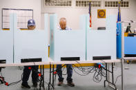 FILE - People vote in the primary election at the Moapa Community Center in Moapa, Nev., Tuesday, June 14, 2022. Elected officials in a rural Nevada county decided Thursday, June 23, 2022, to postpone until Friday certifying results of the 317 votes cast in their jurisdiction during the state's June 14 primary election. The decision in Nevada comes a week after lawmakers in a Republican-leaning rural New Mexico county initially refused to certify their primary election results. (Wade Vandervort/Las Vegas Sun via AP, File)