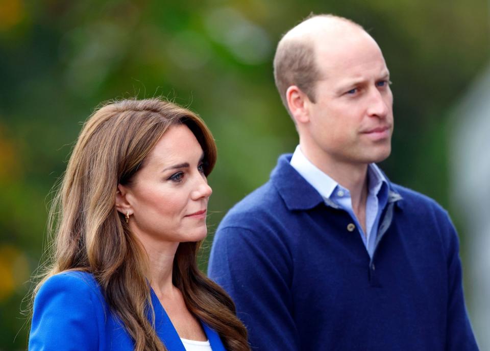 Catherine, Princess of Wales and Prince William stand side by side in a garden