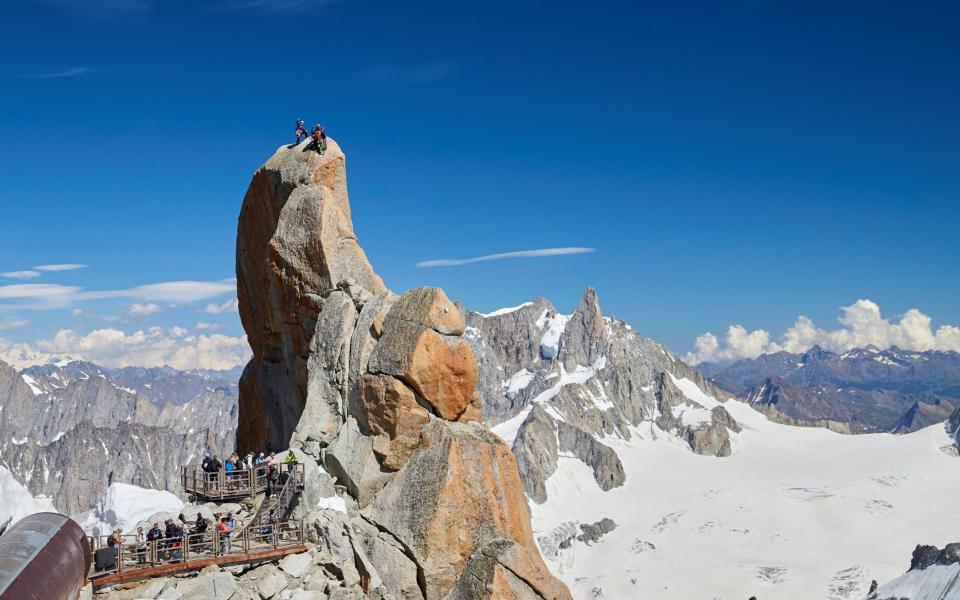 Tourists on top of the Aiguille du Midi near Mont Blanc - Reuters