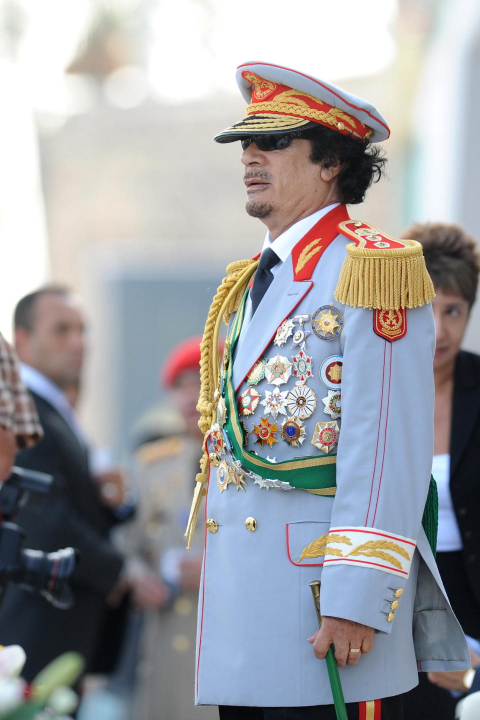 Nothing says 'I've still got it' like some golden tassles and a chest full of badges. This is the last word in tyrannical chic.       Gaddafi at a parade organised in Tripoli, Libya, on September 1st, 2009 to celebrate the 40th anniversary of his coup. 