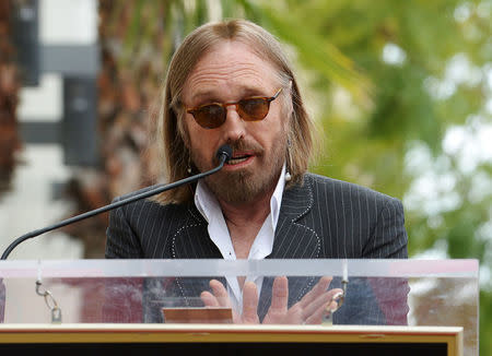 FILE PHOTO: Musician Tom Petty speaks at a ceremony where Jeff Lynne receives a star on the "Hollywood Walk of Fame" in Los Angeles, U.S., April 23, 2015. REUTERS/Phil McCarten/File Photo