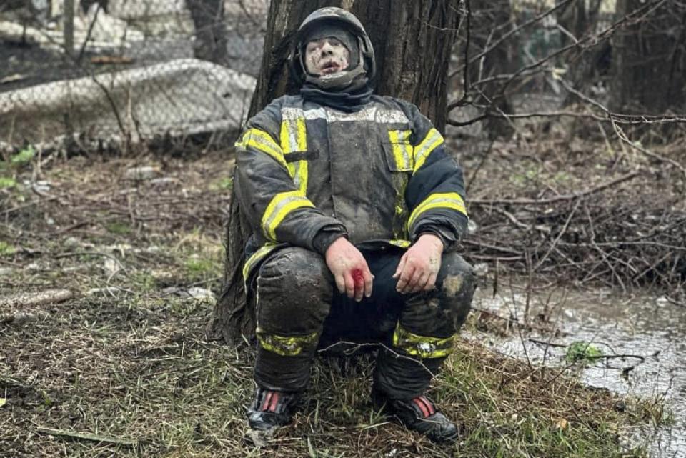 An injured rescuer after the missile attack in Odesa on Friday (Ukrainian Emergency Service/AFP)