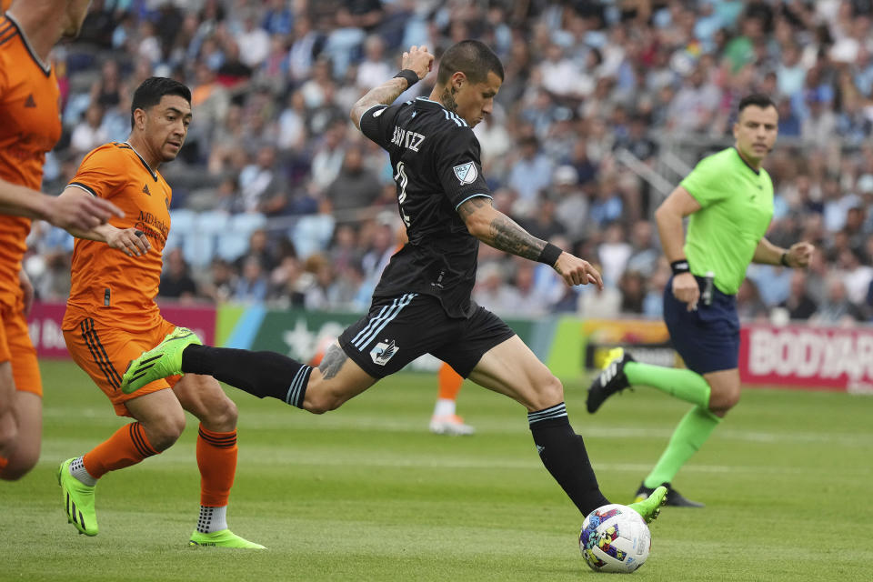 Minnesota United defender Alan Benítez (2) sends the ball up field during the first half of an MLS soccer game against the Houston Dyanamo Saturday, Aug. 27, 2022 at Allianz Field in St. Paul, Minn. (Anthony Souffle/Star Tribune via AP)