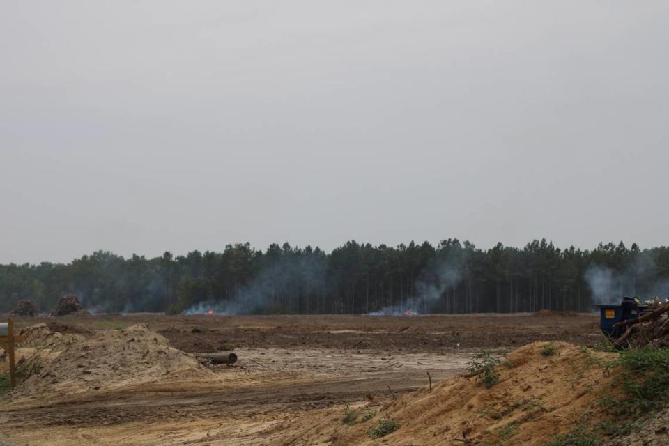 Piles of trees litter that landscape after being cut to make room for a new electric vehicle plant in Blythewood, SC.