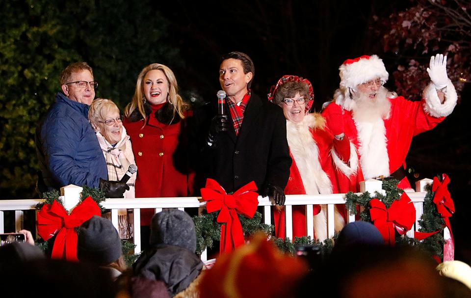 Mayor Matt Miller acknowledges the gift that Dick and Ronda Poorbaugh, left, made to the city for the new Christmas decorations as Melanie Miller and Mrs. Claus and Santa look on before the annual Christmas Tree lighting and fireworks in The Corner Park after the Christmas Parade on Saturday, Dec. 4, 2021. TOM E. PUSKAR/TIMES-GAZETTE.COM