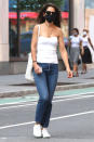 <p>Katie Holmes wears a white strapless top and gold accessories while out in N.Y.C. on Thursday.</p>