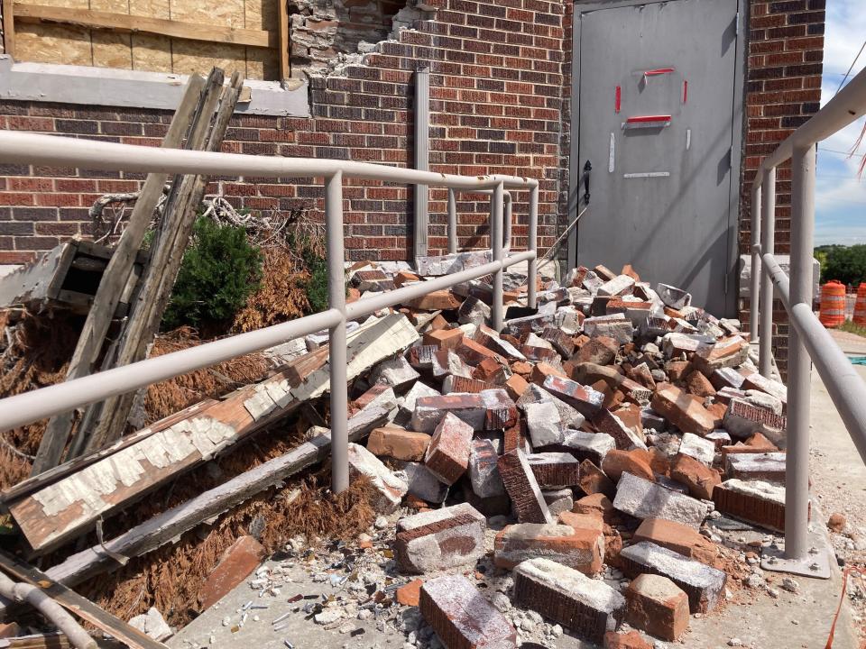 Bricks cover a ramp outside the Albany Building at 125 E. Seventh St. on June 15, 2023, in Pueblo, Colo.