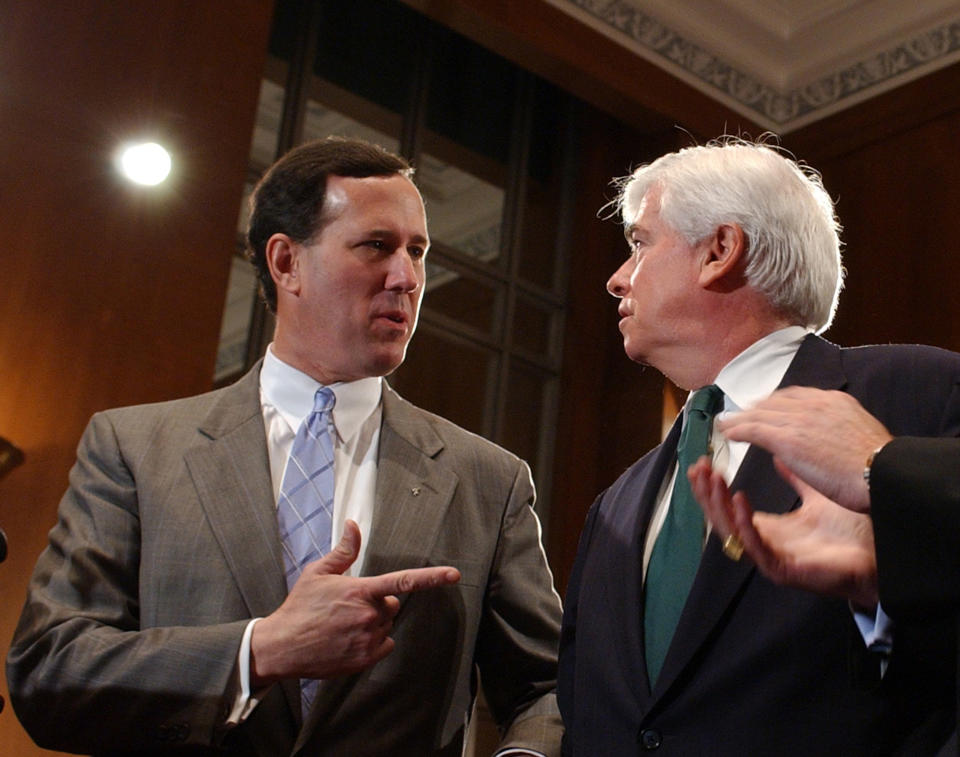 FILE - In this April 19, 2005 file photo, then-Sen. Rick Santorum, R-Pa., left, talks with then-Sen. Christopher Dodd, D-Conn., on Capitol Hill in Washington. Rick Santorum boasts that deep conservative values make him a stronger challenger against President Barack Obama this fall than likely GOP nominee Mitt Romney. (AP Photo/Dennis Cook, File)