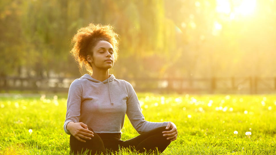 woman meditating outside