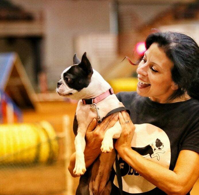 Frankie, a seven-year-old Boston Terrier pictured with her owner, Kathy McClung.