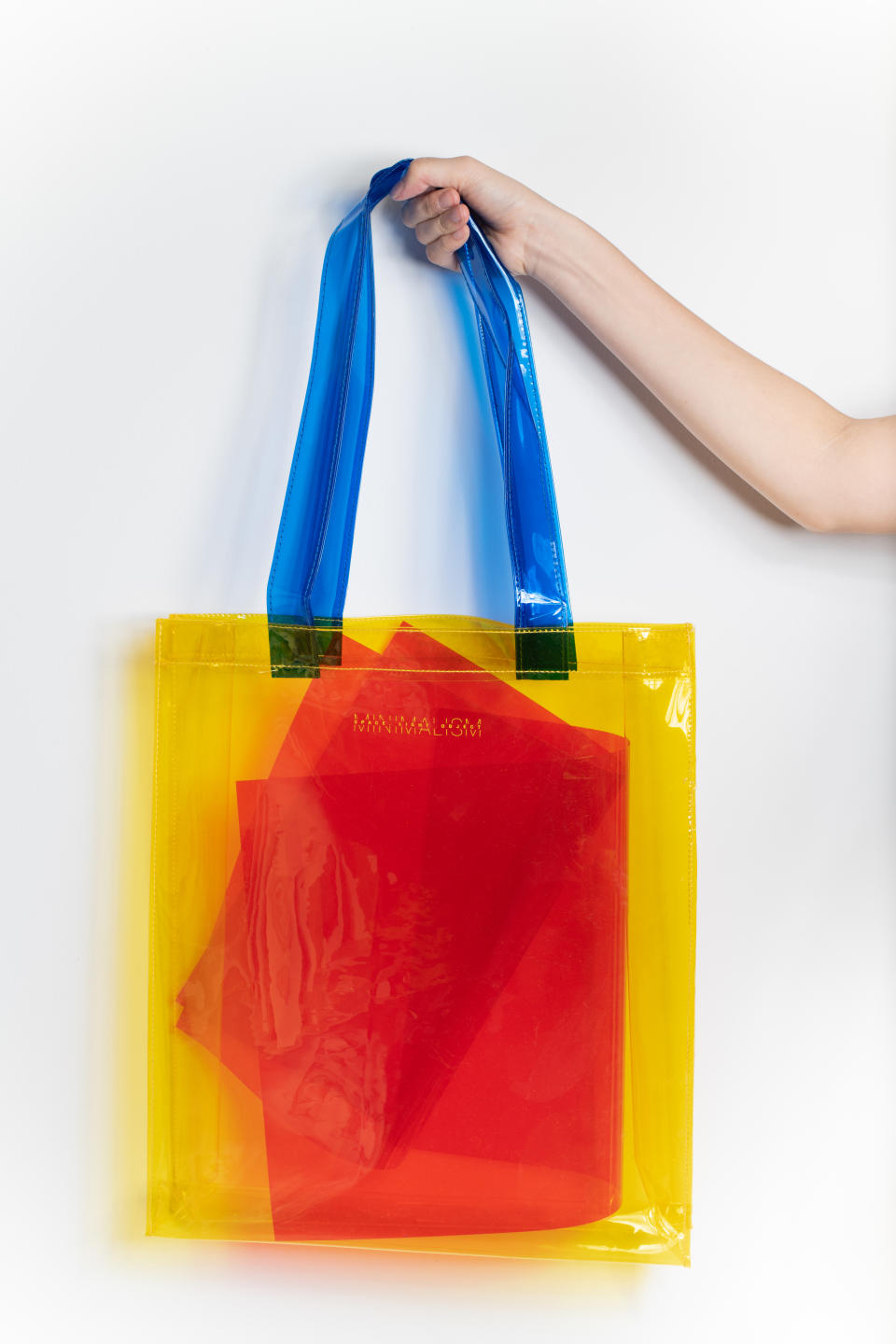 Tote bags in neon-coloured PVC (SGD 29.90). (Photo: Gallery & Co.)