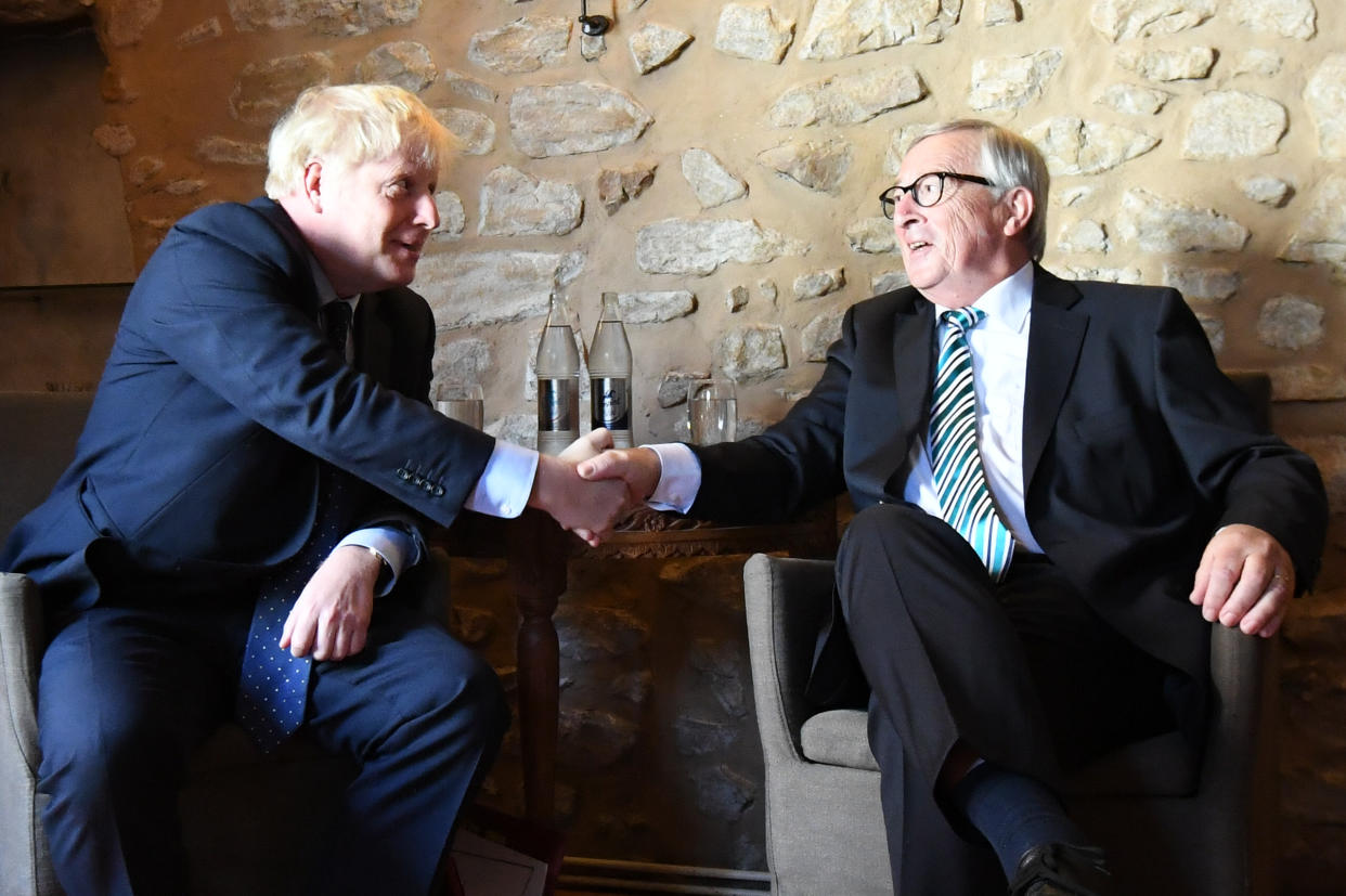 Prime Minister Boris Johnson with European Commission President Jean-Claude Juncker, inside Le Bouquet Garni restaurant in Luxembourg, prior to a working lunch on Brexit.