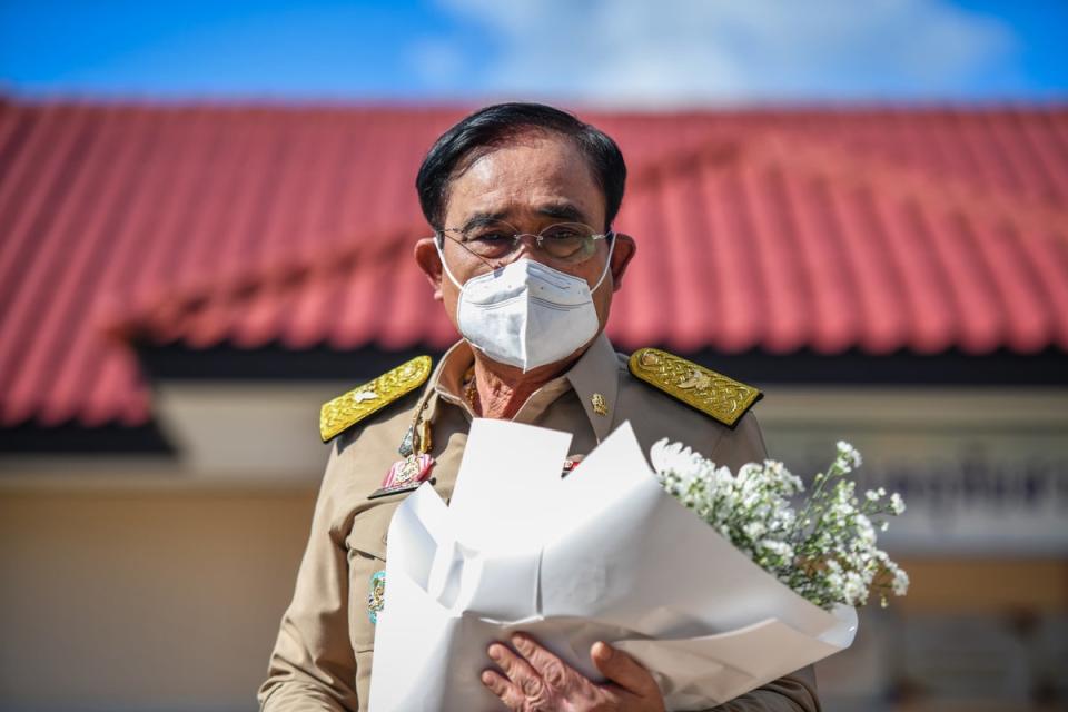 Thailand's Prime Minister Prayuth Chan-o-cha lays flowers outside the nursery on Friday (Getty Images)