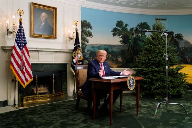 President Donald Trump spoke with reporters following a video chat with members of the military and the tiny desk he sat at became a meme.