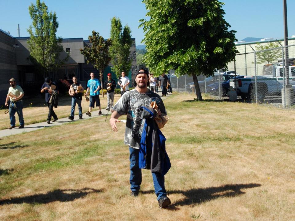 Inmates smile at their new freedom Wednesday, May 30, 2012, after being released from the jail in Grants Pass, Ore., due to layoffs of guards forced by the failure of a tax increase. The Josephine County Sheriff’s Office released 39 inmates, dropping the population at the jail to 60 _ half of them federal prisoners held on contract. About half will finish their sentences on work crews, while the rest were waiting for trial. The most common charges were for drug crimes, minor assaults, burglary, identity theft and probation violations. (AP Photo/Jeff Barnard)